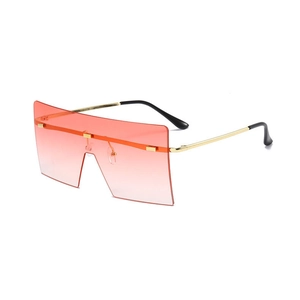 Frameless oversized square sunglasses with orange gradient lenses and gold metal temples