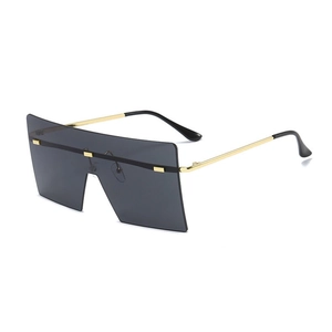 Oversized rimless square sunglasses with dark grey gradient lenses and gold metal temples