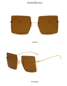 Front and 45-degree angle views of vintage oversized square sunglasses with gold metal frame