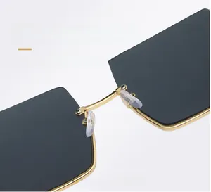 Detail of comfortable silicone nose pads and golden metal bridge on retro sunglasses