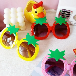 Kids pineapple-shaped sunglasses in yellow, red, and pink for a trendy fashion look