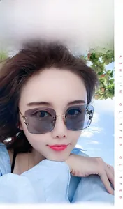 Detail view of retro square frameless sunglasses with gradient blue lenses and gold metal frame