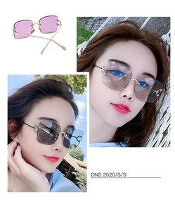 Detail of rimless square sunglasses featuring metal temples and pink gradient lenses