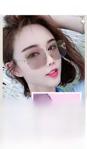 Detail of trendy square rimless sunglasses with gradient lenses and U-shaped gold hinges