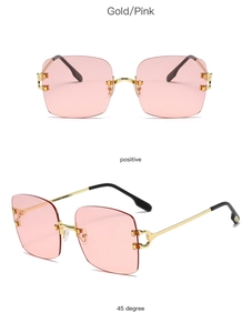 Detailed view of rimless square sunglasses with pink lenses and gold C-hinge detail