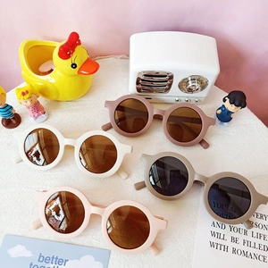 Chic round frame children's UV sunglasses in brown, beige, and pink trendy colors