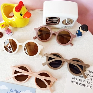 Retro round frame kids sunglasses in white, pink, and khaki with UV protection