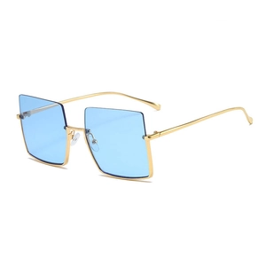 Retro oversized square sunglasses with gold metal frames and light blue tinted lenses