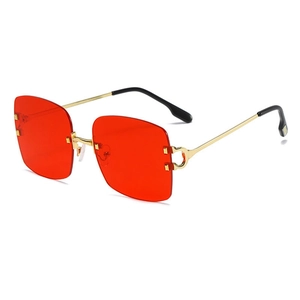 Retro square oversized red lens sunglasses with gold metal temples and decorative hinge