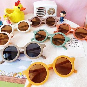Set of colorful round children's sunglasses with matte frames for sun protection