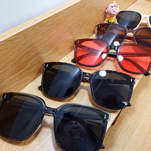 Collection of oversized square sunglasses in multiple colors featuring metal dot accents
