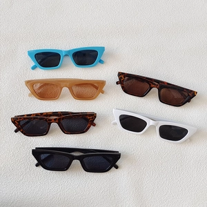 Retro rectangle cat eye sunglasses collection in six stylish colors on white textured surface