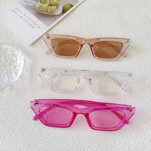Detailed view of three vintage cat eye sunglasses in transparent acetate frames