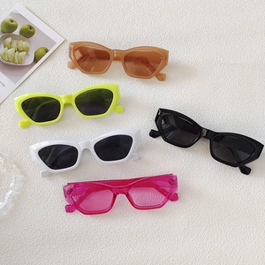 Detailed display of vintage cat-eye sunglasses in multiple neon and neutral colors