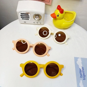 Kids round frame sunglasses in beige, pink and yellow with UV protection lenses