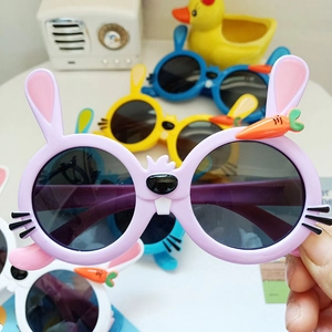 Close-up of cute rabbit shaped polarized kids sunglasses with carrot detail and silicone frames