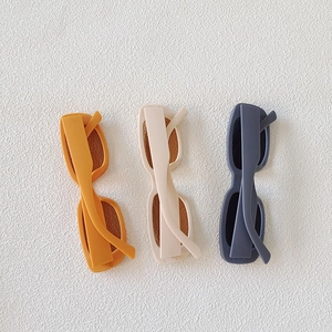 Three colors of slim rectangular sunglasses in matte finish for a minimalist look