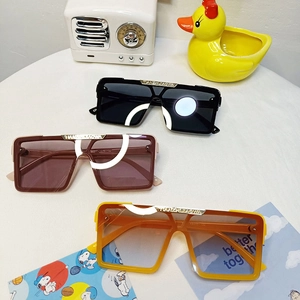 Stylish square oversized kids sunglasses in black, brown and orange with UV protection