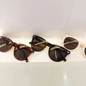 Three-pack vintage cat-eye sunglasses in black, tortoiseshell, and ivory white frames
