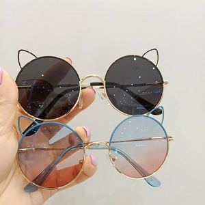 Kids round cat-ear sunglasses with metal frames in black and blue gradient lenses