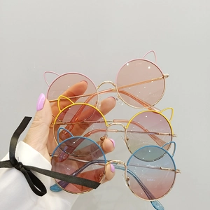 Set of three round cat-ear metal frame sunglasses for kids in pink, blue, and yellow tints