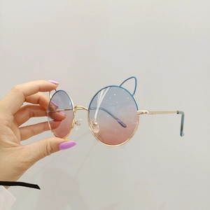Fashionable cat ear round sunglasses with blue-pink gradient lenses and gold metal frame