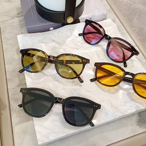 Modern oversized sunglasses collection in black and tortoiseshell with vibrant tinted lenses