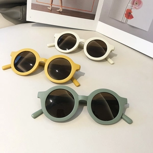 Retro round frame children sunglasses in off-white, yellow, and green matte finish