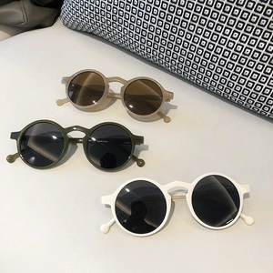 Retro round sunglasses for men and women in khaki, dark green, and white frames