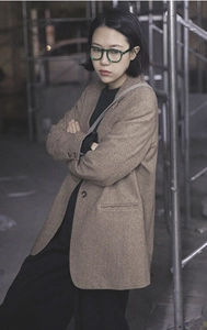 Brown oversized wool-blend blazer featuring a minimalist single-breasted design and pockets