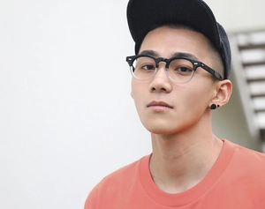 Close-up of stylish dual-tone square anti-blue light glasses on model with casual look