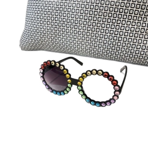 Kids round sunglasses with rainbow rhinestones and black frame on white background