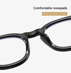 Detail of integrated thickened nose pads on black glossy frames for pressure relief