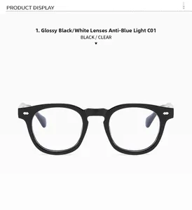 Detail of glossy black anti-blue light glasses frame with vintage silver rivet accents