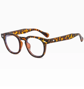 Detailed side view of tortoise shell retro round glasses with metal rivet accents