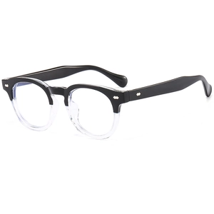 Retro two-tone blue light blocking glasses with black and clear frames and silver rivets