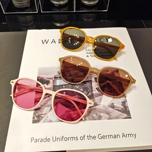 Three pairs of stylish small-frame irregular sunglasses in yellow, khaki and white colors