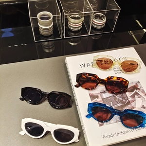 Trendy cat-eye sunglasses in multiple colors on a stylish desktop display background