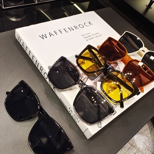 Detail shot of vintage square sunglasses with CE mark and metal hinge on artistic catalog