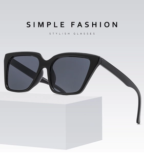 Detailed side view of stylish black square sunglasses on a minimalist white display