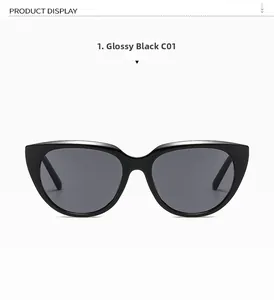 Detail of bright black cat eye sunglasses with high-gloss frame and dark grey lenses