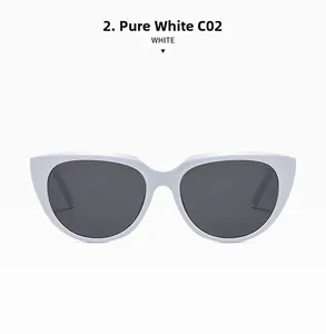 Detail view of solid white cat eye frame sunglasses with dark grey protective lenses