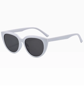 Detail of white cat eye round frame sunglasses with dark lenses and matte finish