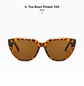 Front view of retro cat-eye sunglasses in tortoiseshell demi pattern with dark tea lenses