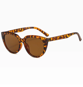 Close-up of cat-eye sunglasses with classic tortoiseshell PC frame and brown lenses