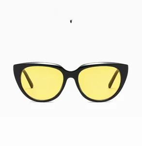 Detail of C05 cat-eye sunglasses with glossy black frame and bright yellow lenses