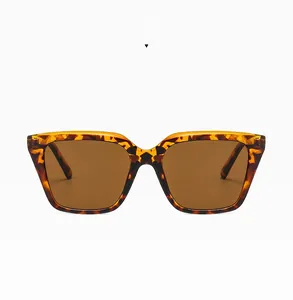 Close-up of retro square tortoiseshell sunglasses with brown resin lenses and demi frame