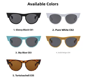 Flat lay of retro cat-eye sunglasses in black, white, blue, beige, and tortoise shell