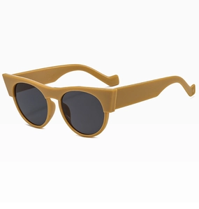 Detail of vintage round cat-eye sunglasses featuring mustard yellow frames and wave-pattern temples