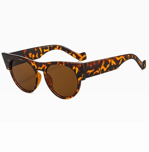 Side view of retro cat eye sunglasses with tortoise shell frame and brown lenses